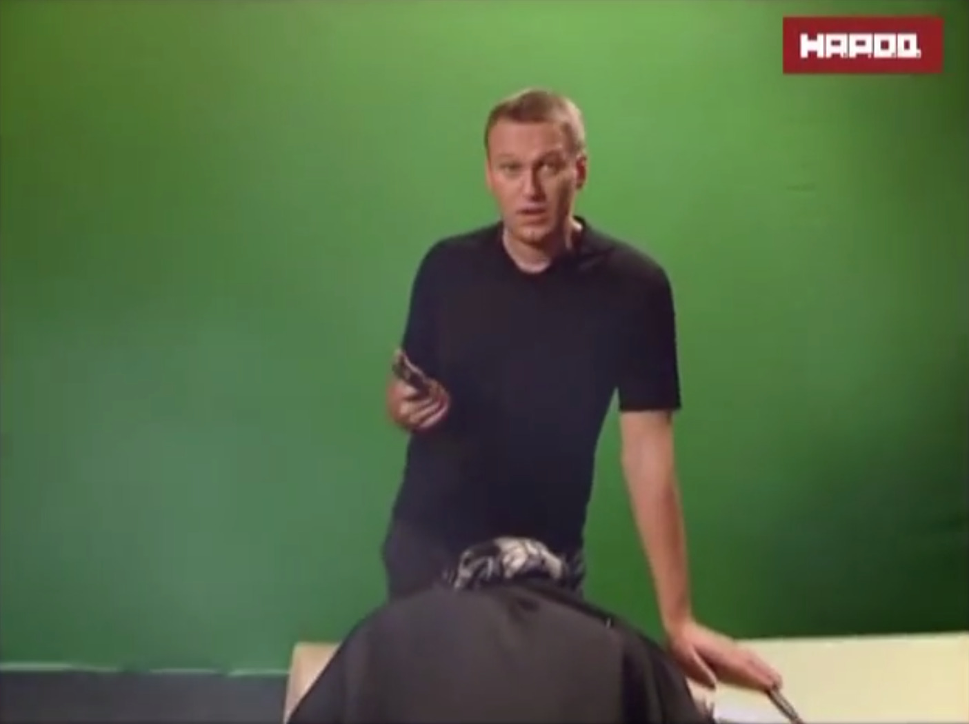 Navalny standing over the body