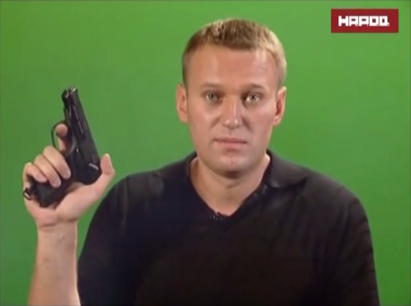 Navalny holding up his pistol