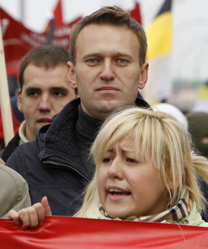 Alexei Navalny and nationalist flags at a Russian March rally