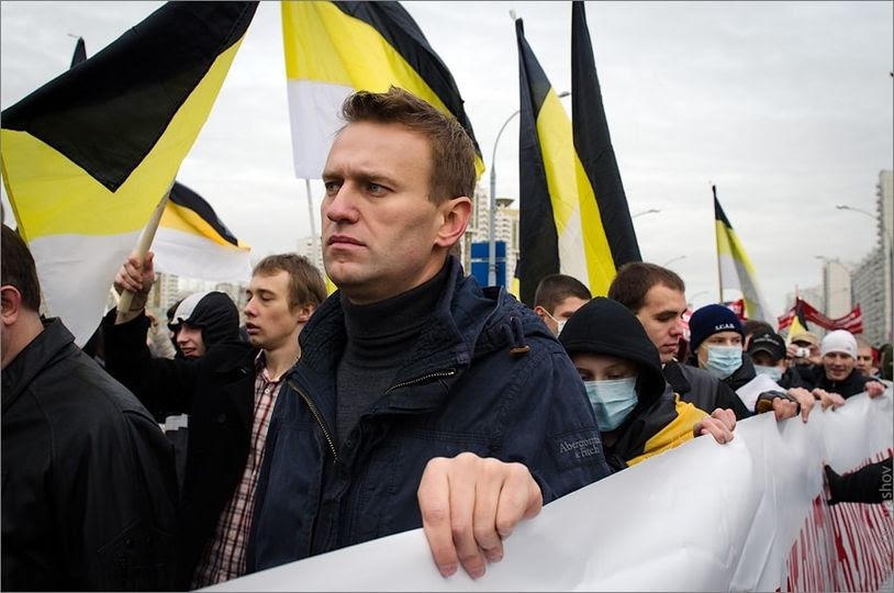 Alexei Navalny and nationalist flags at a Russian March rally